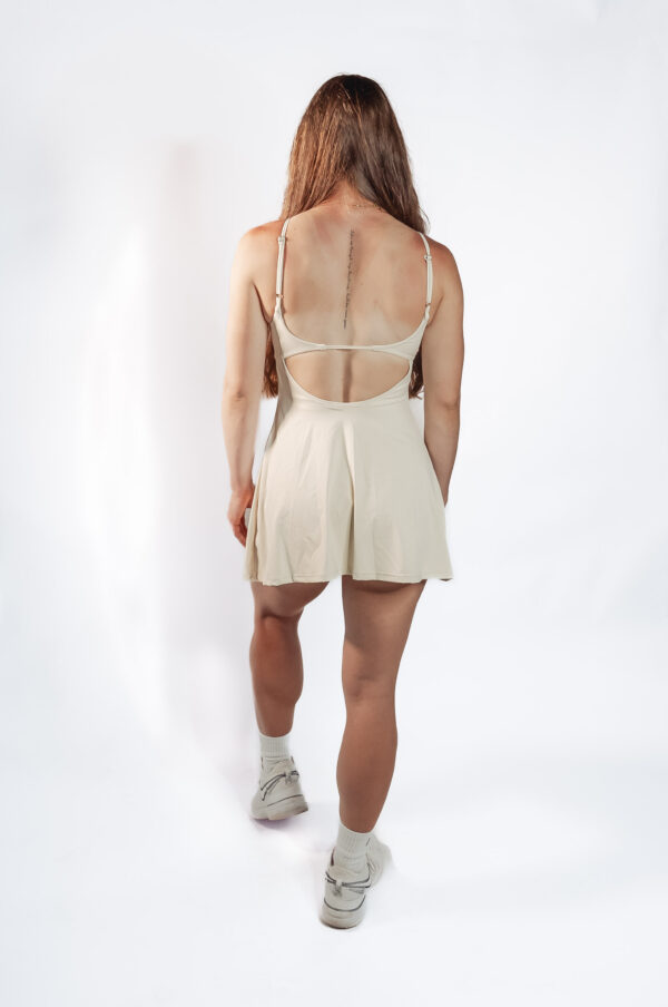 Model Kae wearing Good Dink dress with open back, rear view